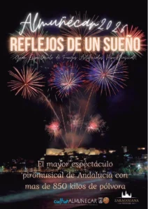 Cartel del espectáculo piromusical "Reflejos de un Sueño" en la Feria de Almuñécar 2026, con fuegos artificiales sobre el Castillo de San Miguel.